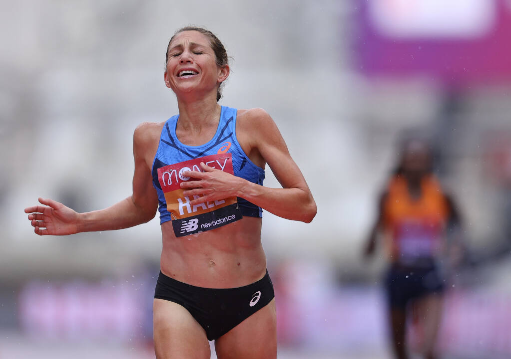 Sara Hall sprints to the finish line to take second place ahead of Kenya’s Ruth Chepngetich in the London Marathon on Sunday, Oct. 4, 2020. (Richard Heathcote / Pool)