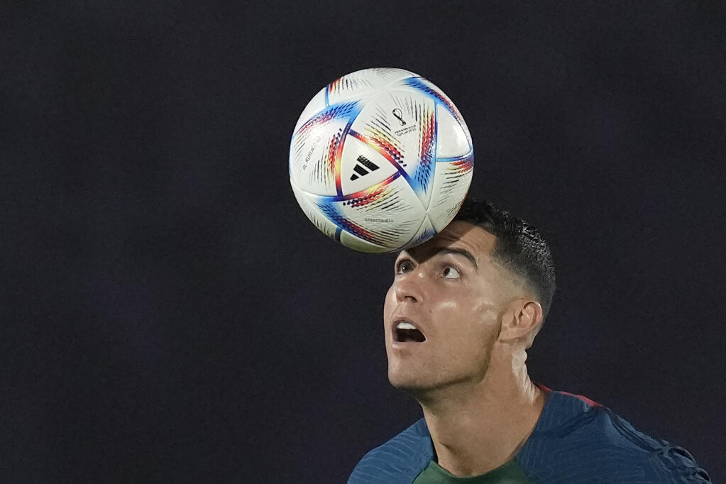 Portugal’s Cristiano Ronaldo controls a ball during training on the eve of Thursday’s World Cup game against Ghana in Al Shahaniya, Qatar. (Lee Jin-man / ASSOCIATED PRESS)