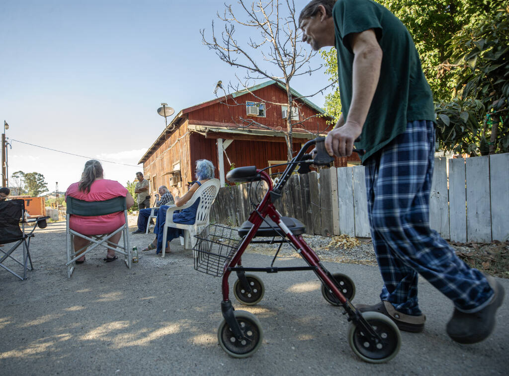 Soul Cotton makes his way to a meeting of Rockwell Road residents to discuss termination-to-tenancy notices after their Cloverdale trailer park was purchased and the new owner has given them 60 days to vacate. Photo taken Wednesday, Aug. 16, 2023. (Chad Surmick / The Press Democrat file)