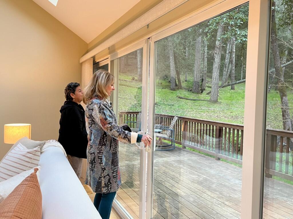With Oakmont amenities and beauty, resident Rosie Quinones and local Realtor Cristie Marcus tour the Cliffwood Court house in 95409, a hot ZIP code for property. Photo by Susan Wood