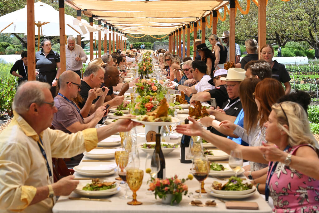 Guests enjoying a menu prepared by Chef Maneet Chauhan and Chef Tracey Shepos Cenami during the Garden-to-Table Lunch at the Healdsburg Wine and Food Experience on Friday, May 19, 2023 at Kendall-Jackson Wine Estates & Gardens in Santa Rosa. (Erik Castro / For The Press Democrat)