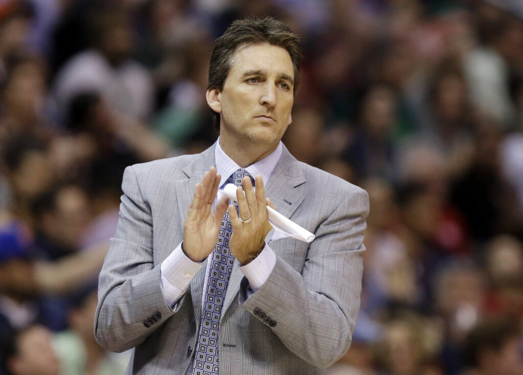 FILE - In this March 17, 2013, file photo, Los Angeles Clippers head coach Vinny Del Negro aplaudes during  the second half of an NBA basketball game against the New York Knicks in Los Angeles. (AP Photo/Reed Saxon, File)