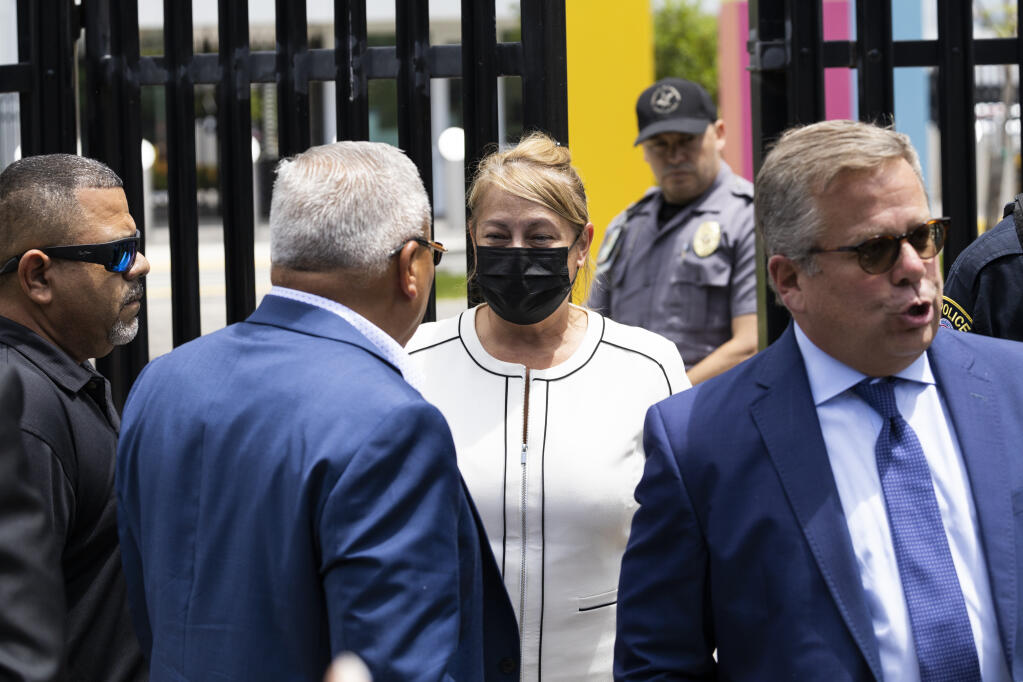 Puerto Rico's former Gov. Wanda Vazquez leaves a court after she was released on bail, in San Juan, Puerto Rico, Thursday, Aug. 4, 2022. Vazquez, who was arrested Thursday, is accused of engaging in a bribery scheme from Dec. 2019 through June 2020, while she was governor, with several people including a Venezuelan-Italian bank owner, a former FBI agent, a bank president and a political consultant. (AP Photo/Alejandro Granadillo)