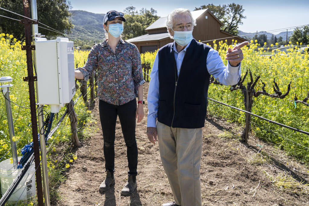 Warren Winiarski with Beth Forrestel, an assistant professor in the Department of Viticulture and Enology at the University of California Davis. Winiarski is funding work to measure effects of climate change on wine growing. There are 18 monitoring sites set up in the Napa Valley with some high-tech tools to more precisely measure environmental conditions related to climate change.