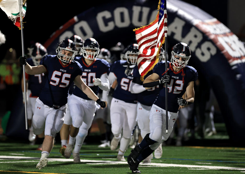 Rancho Cotate takes the field prior to their playoff game against Granada, Friday, Nov. 12, 2021 in Rohnert Park. (Kent Porter / The Press Democrat) 2021
