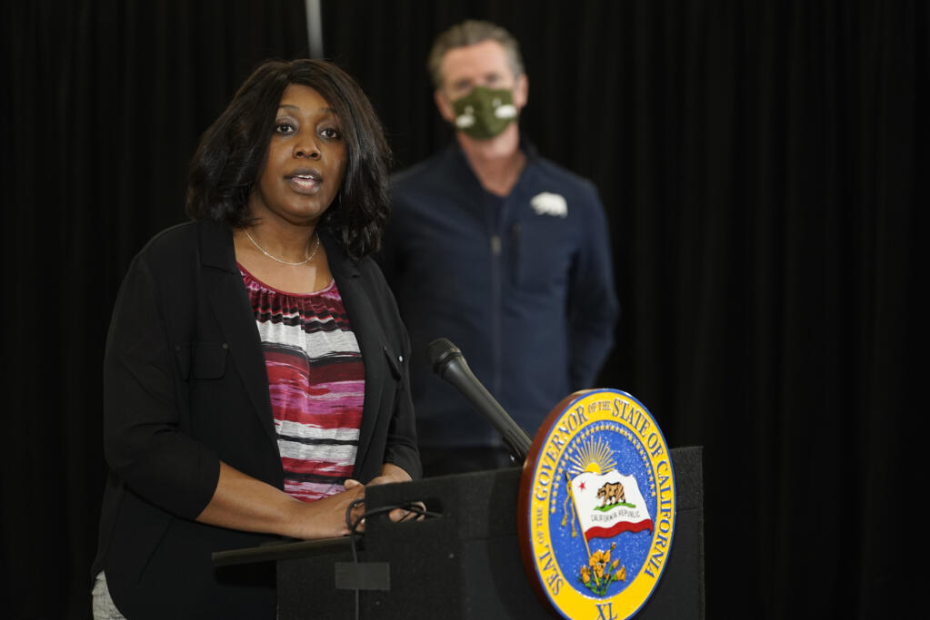 Yolanda Richardson, Government Operations Agency Secretary at State of California takes questions from the media about the COVID-19 Johnson and Johnson coronavirus vaccine at the Baldwin Hills Crenshaw Plaza, a shopping mall in a historically Black neighborhood southwest of downtown Los Angeles Thursday, April 1, 2021. (AP Photo/Damian Dovarganes)