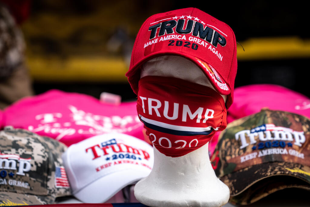 Donald Trump is hawking campaign merchandise in fundraising emails. (ERIN SCHAFF / New York Times)