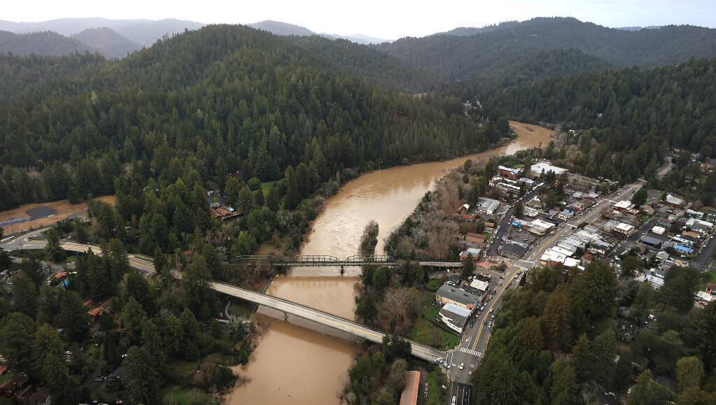 The Russian River in Guerneville flowing precariously close to minor flood stage, Sunday, Jan. 8, 2023. (Kent Porter/The Press Democrat file)