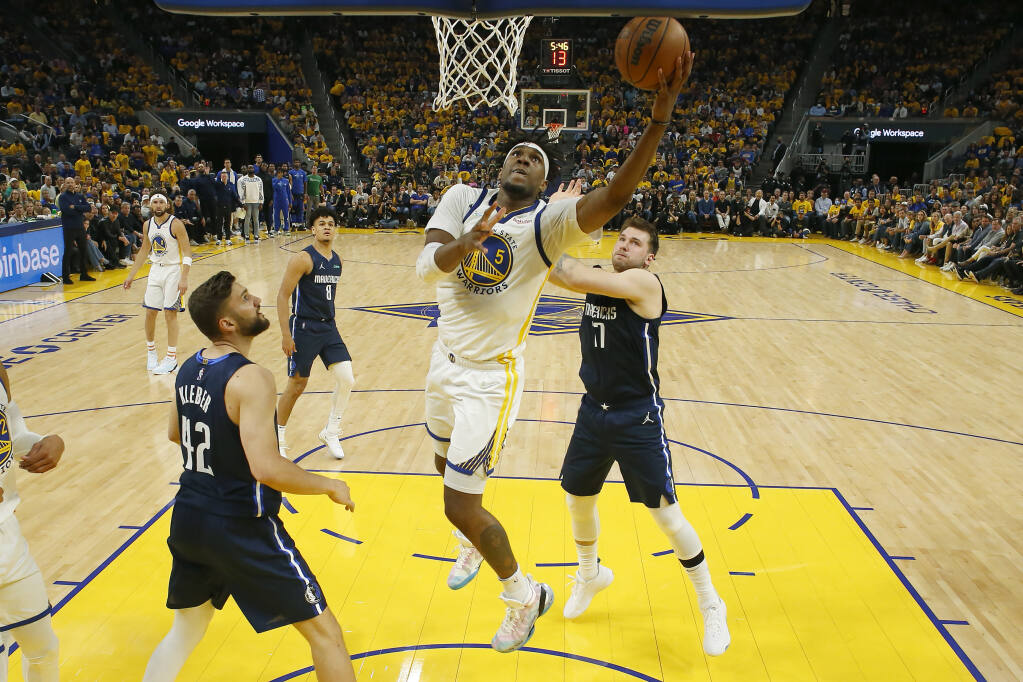 Warriors center Kevon Looney shoots against the Dallas Mavericks during the first half of Game 2 of the Western Conference Finals in San Francisco on Friday, May 20, 2022. (Jed Jacobsohn / ASSOCIATED PRESS)