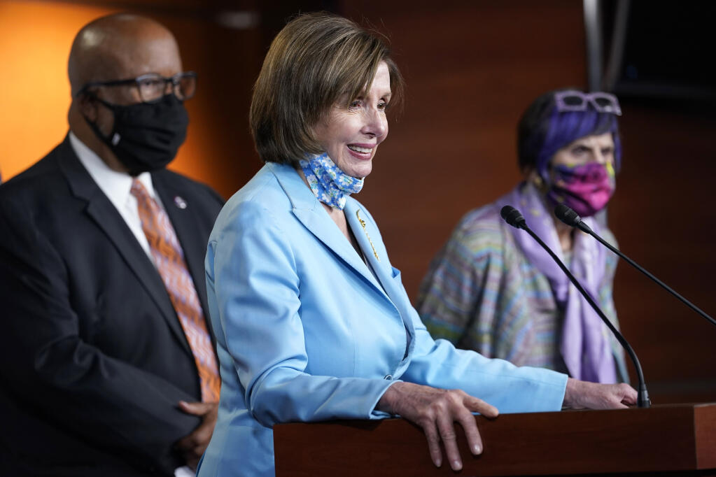 House Speaker Nancy Pelosi of Calif., center, flanked by Rep. Benny Thompson, D-Miss., left, and Rep. Rosa DeLauro, D-Conn., right, talks to reporters on Capitol Hill in Washington, Wednesday, May 19, 2021, about legislation to create an independent, bipartisan commission to investigate the Jan. 6 attack on the United States Capitol Complex. Thompson is chairman of the House Homeland Security Committee and negotiated a bipartisan bill outlining a commission to investigate the Jan. 6 attack on the Capitol. (AP Photo/Susan Walsh)