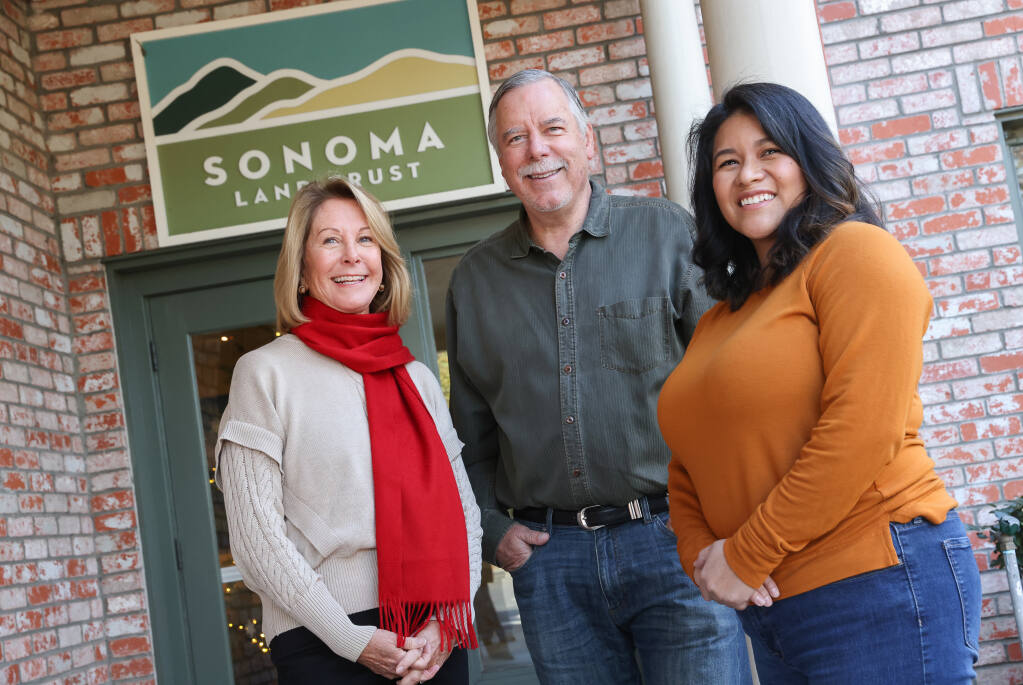 New Sonoma Land Trust board members Liz Fisher, left, Frank Dean, and Gymmel Trembly in Santa Rosa on Friday, December 2, 2022.  (Christopher Chung/The Press Democrat)