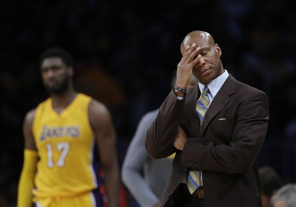 FILE - In this March 4, 2016, file photo, Los Angeles Lakers coach Byron Scott wipes his forehead during the second half of the Lakers' NBA basketball game against the Atlanta Hawks in Los Angeles. Scott told ESPN in an interview broadcast May 4, 2016 that he was 'shocked' the team fired him last week. (AP Photo/Jae C. Hong, File)