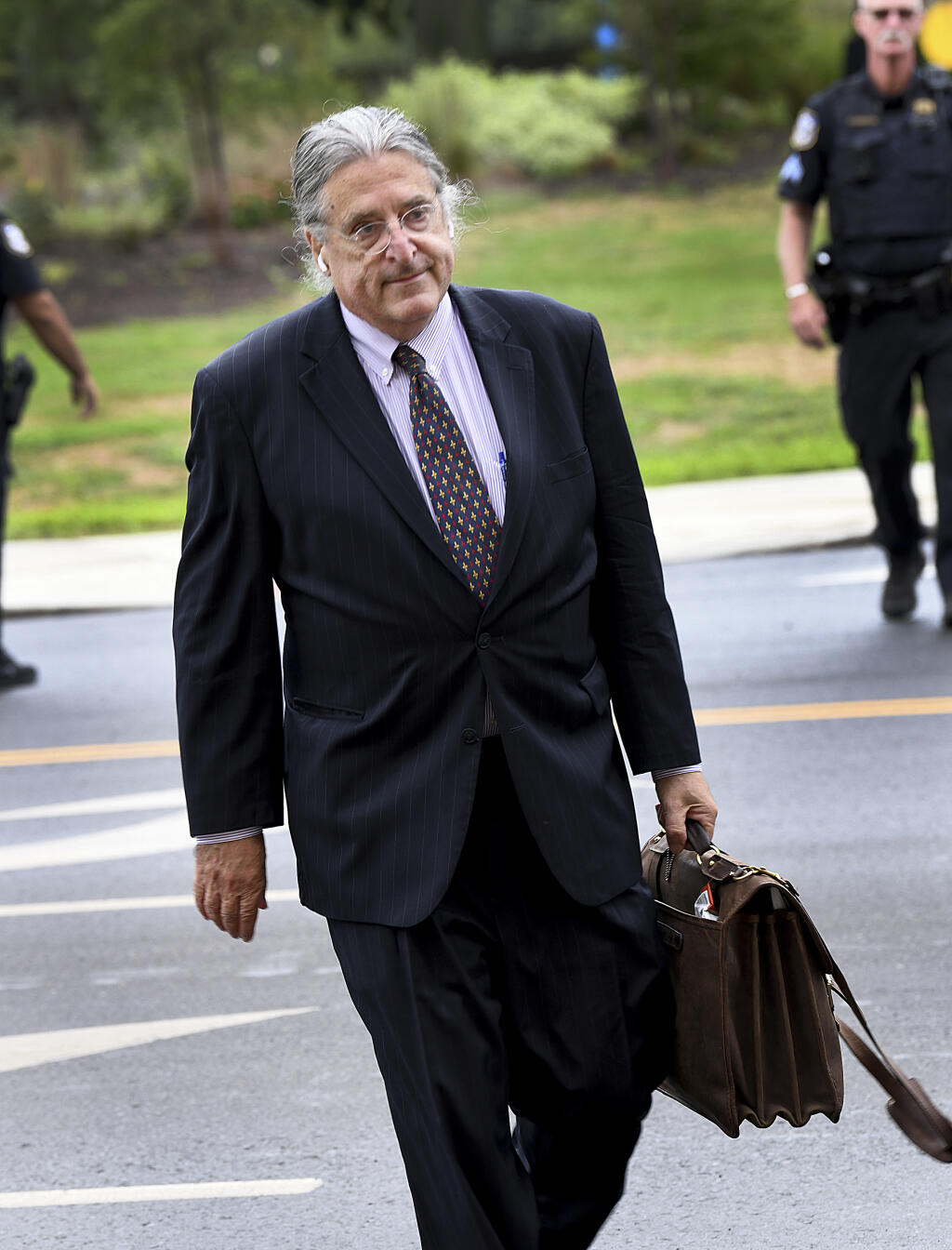 Norm Pattis, attorney for conspiracy theorist Alex Jones, arrives at Waterbury Superior Court, Tuesday morning, Sept. 13, 2022, in Waterbury, Conn., for the start of Jones' trial. A Connecticut jury began hearing arguments Tuesday in a trial to decide how much money Jones should pay relatives of victims of the Sandy Hook Elementary School shooting for spreading a lie that the massacre was a hoax. (Carol Kaliff/Hearst Connecticut Media via AP)