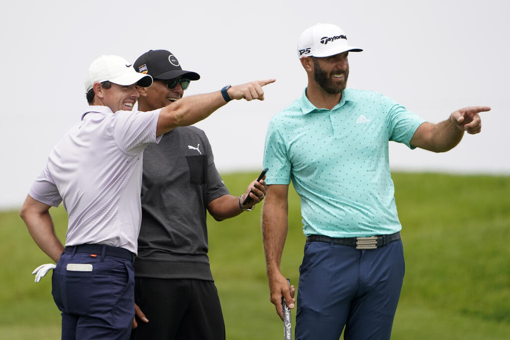Rory McIlroy, left, and Dustin Johnson, right, point from the second tee box during a practice round for the U.S. Open on Wednesday, June 16, 2021, at Torrey Pines Golf Course in San Diego. (Jae C. Hong / ASSOCIATED PRESS)