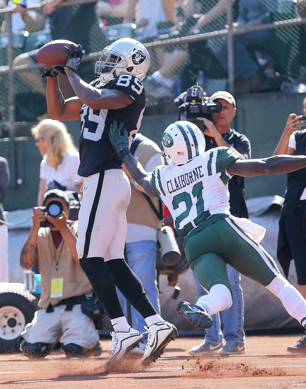 Oakland Raiders wide receiver Amari Cooper is unable to catch the pass in the end zone, but New York Jets cornerback Morris Claiborne is called for pass interference on the play, in Oakland on Sunday, Sept. 17, 2017. (Christopher Chung / The Press Democrat)
