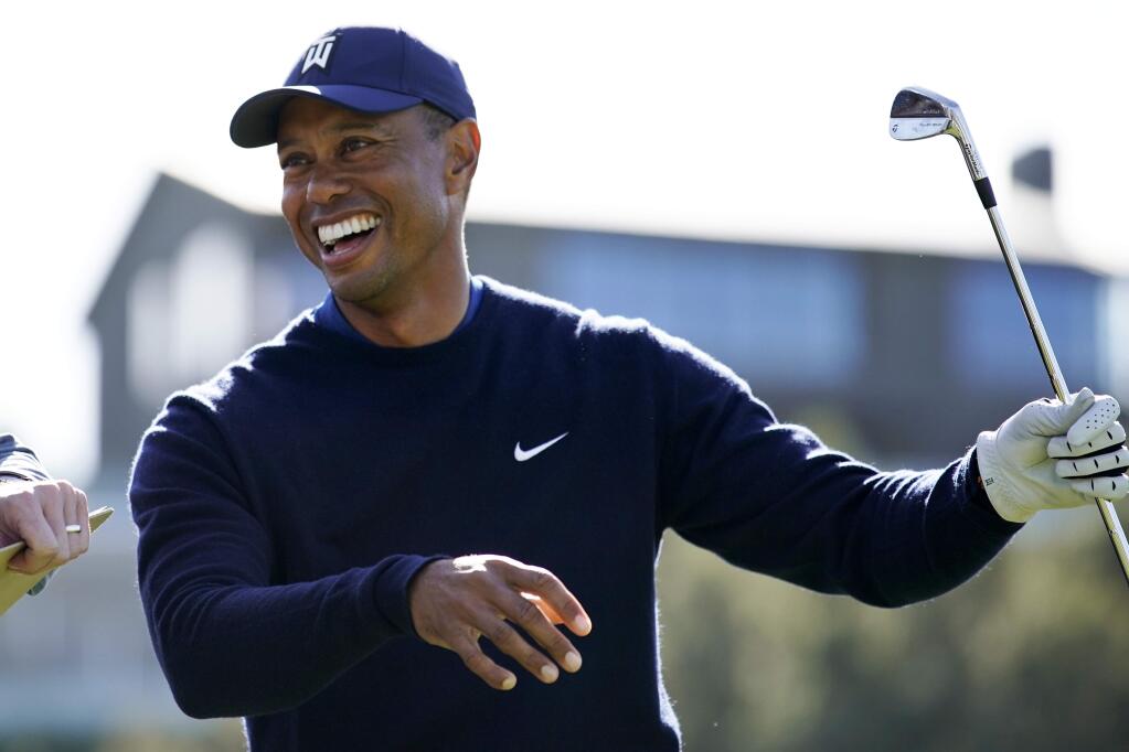 Tiger Woods smiles after hitting his tee shot on the 16th hole during the Genesis Invitational pro-am at Riviera Country Club, Wednesday, Feb. 12, 2020, in the Pacific Palisades area of Los Angeles. (AP Photo/Ryan Kang)