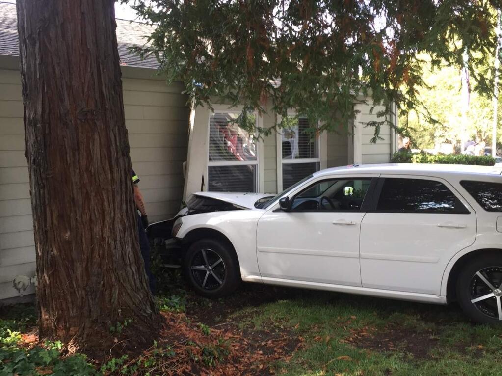 A vehicle crashed into a Santa Rosa apartment building, injuring a man sitting inside on Tuesday, Aug. 29, 2017. (SANTA ROSA BATTALION CHIEF MARK BASQUE)