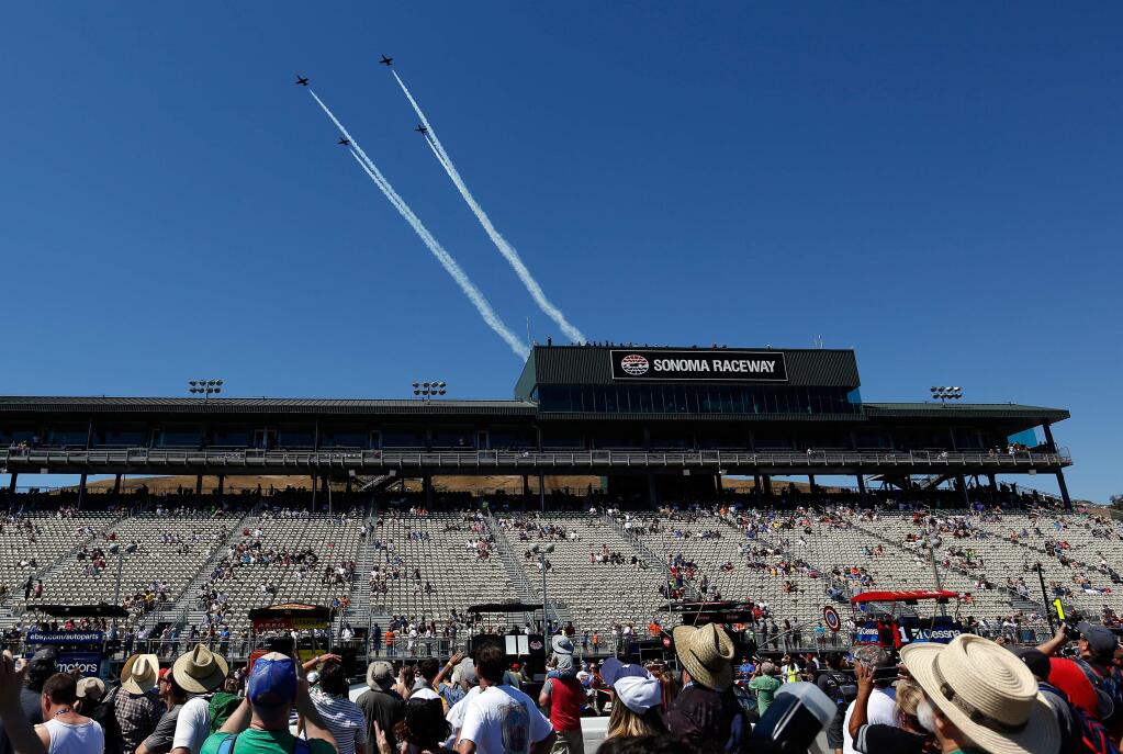 The Patriots Jet team flies above the main grandstand in the pre-race show before the Monster Energy NASCAR Cup Series Toyota/Save Mart 350 race at Sonoma Raceway, in Sonoma on Sunday, June 24, 2018. (Alvin Jornada / The Press Democrat)