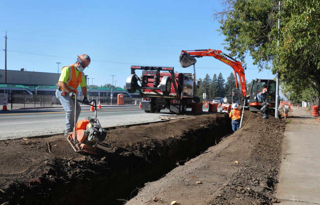 Jose Vasquez works on infrastructure improvements funded through Measure M, the current roads tax, along Airport Boulevard in Santa Rosa on Thursday, Oct. 15, 2020. (Christopher Chung / The Press Democrat)