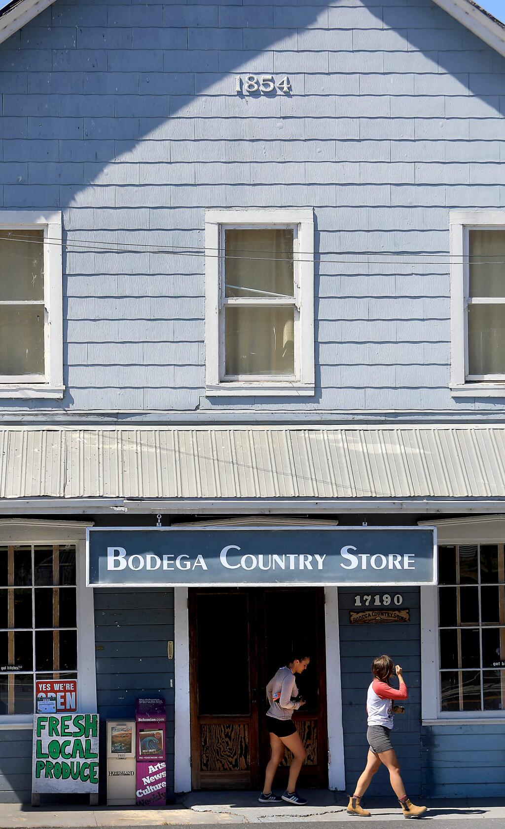Customers exit the recently reopened Bodega Country Store, Friday, Sept. 7, 2018 in Bodega. (Kent Porter / The Press Democrat) 2018