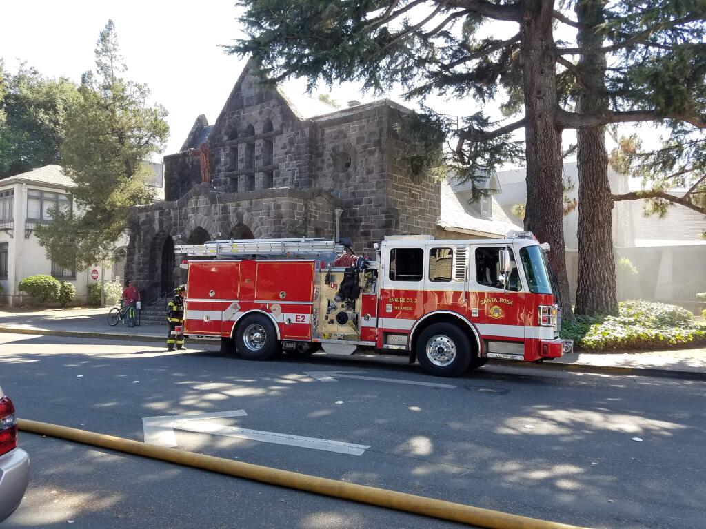 Firefighters responded to a small fire inside the St. Rose Catholic Church in Santa Rosa on Thursday, Aug. 11, 2016. (George Buce/The Press Democrat)