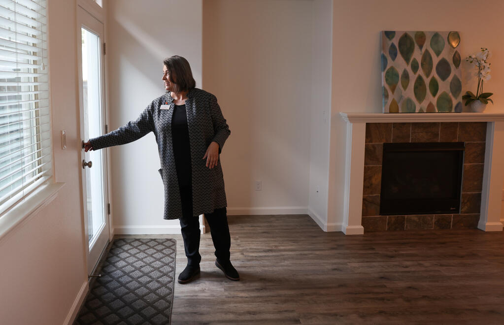 Real estate agent Carmen Cervantes does a walkthrough check on a house she has listed in Santa Rosa, Friday, Dec. 2, 2022.  (Christopher Chung/The Press Democrat)