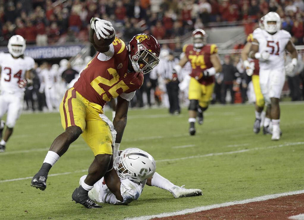 Southern California running back Ronald Jones II (25) scores a touchdown against Stanford safety Justin Reid during the second half of the Pac-12 Conference championship NCAA college football game in Santa Clara, Calif., Friday, Dec. 1, 2017. (AP Photo/Marcio Jose Sanchez)