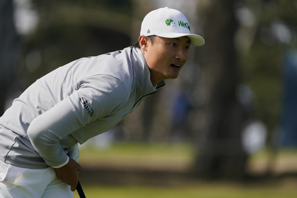 Li Haotong watches his tee shot on the ninth hole during the second round of the PGA Championship at TPC Harding Park Friday, Aug. 7, 2020, in San Francisco. (Charlie Riedel / ASSOCIATED PRESS)