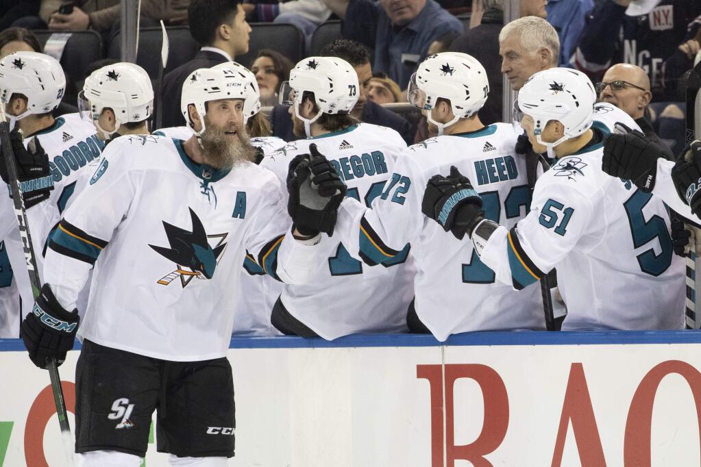 San Jose Sharks center Joe Thornton, left, celebrates after scoring a goal against the New York Rangers during the second period Saturday, Feb. 22, 2020, at Madison Square Garden in New York. (AP Photo/Mary Altaffer)
