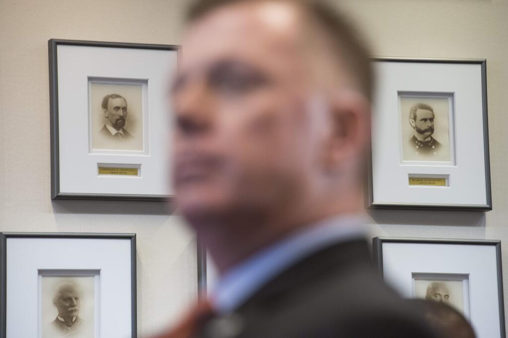 Portraits of former U.S. Secret Service Directors are seen behind U.S. Secret Service Director James Murray during an announcement of the release of the Secret Service National Threat Assessment Center's Protecting America's Schools report, in Washington, Thursday, Nov. 7, 2019. The report examines 41-targeted attacks that occurred in schools between 2008 and 2017. (AP Photo/Cliff Owen)