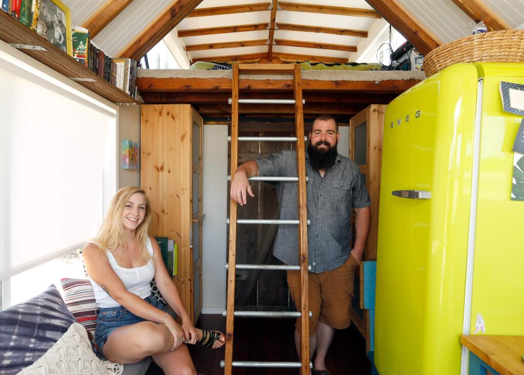 Bree Rathburn and Kieran Murphyin their tiny home in Santa Rosa, California on Saturday, July 22, 2017. (Alvin Jornada / The Press Democrat)