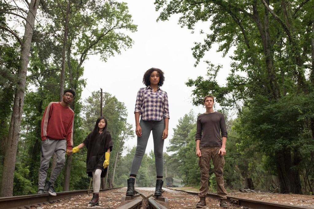 “The Darkest Minds” includes, from left, Skylan Brooks, Miya Cech, Amandla Stenberg and Harris Dickinson as teens with special powers who are feared by adults and hunted down by the government. (20th Century Fox)