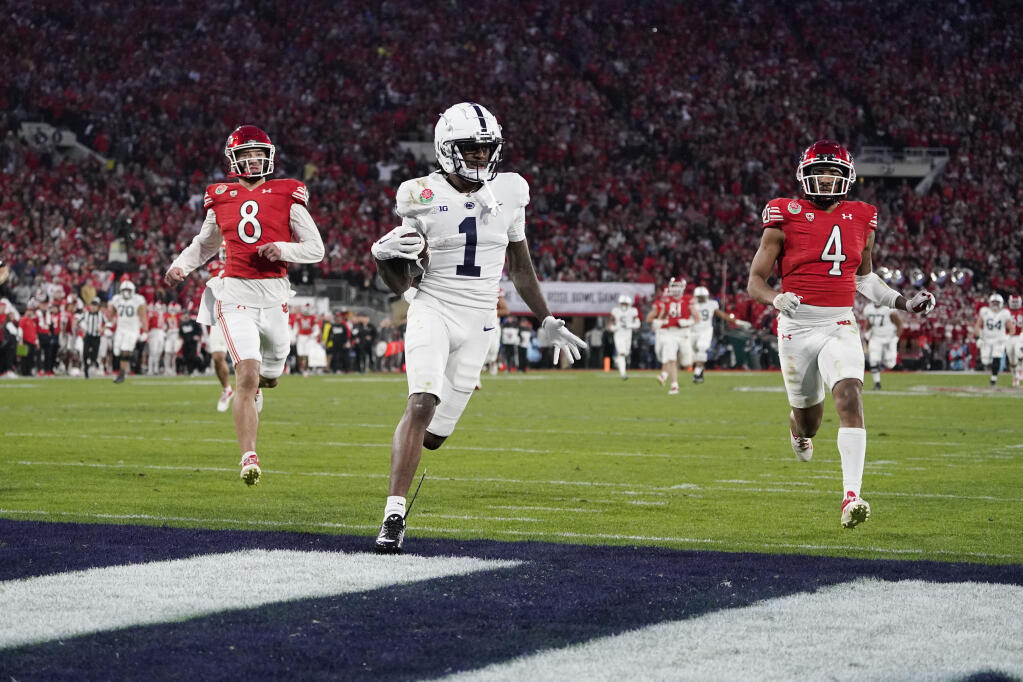 Penn State wide receiver KeAndre Lambert-Smith (1) scores a touchdown during the second half in the Rose Bowl NCAA college football game against Utah Monday, Jan. 2, 2023, in Pasadena, Calif. (AP Photo/Mark J. Terrill)