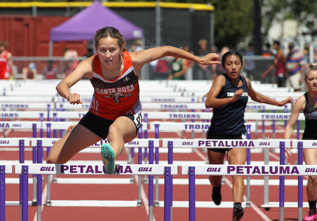 Santa Rosa’s Coco McKamey wins the 100-meter hurdles race during May’s North Coast Section track and field championships in Petaluma. (Darryl Bush / for The Press Democrat)