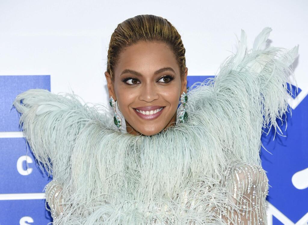 FILE - In this Aug. 28, 2016 file photo, Beyonce Knowles arrives at the MTV Video Music Awards at Madison Square Garden, in New York. Beyonce announced on her Instagram account, Wednesday, Feb. 1, 2017, that she is expecting twins. (Photo by Evan Agostini/Invision/AP, File)