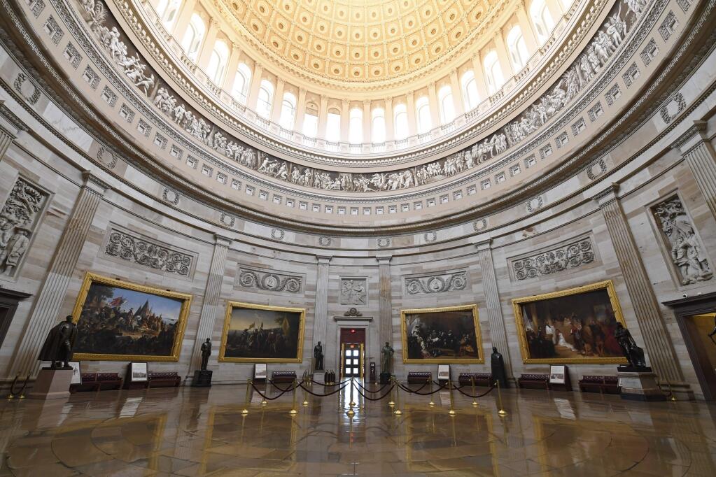 There are no visitors touring the Capitol Rotunda on Capitol Hill in Washington, Friday, March 13, 2020, which has been closed to tourists because of the coronavirus outbreak. (AP Photo/Susan Walsh)