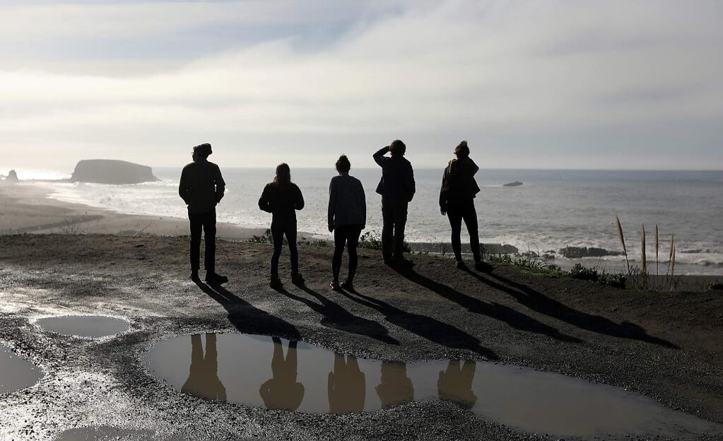 A group of friends and relatives from Sonoma County take in the view of the Pacific Ocean from the Jenner bluffs Friday Jan. 1, 2018. A pristine view as far as the eye can see, the Trump administration has renewed the prospect of offshore oil drilling along the Pacific coast and the reduction of marine sanctuaries. (Kent Porter / The Press Democrat) 2018