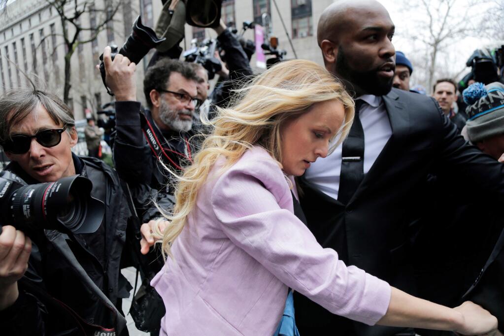 FILE - In this April 16, 2018, file photo, Stormy Daniels arrives at federal court in New York to attend a court hearing where a federal judge is considering how to review materials that the FBI seized from President Donald Trump's personal lawyer to determine whether they should be protected by attorney-client privilege. (AP Photo/Seth Wenig, File)