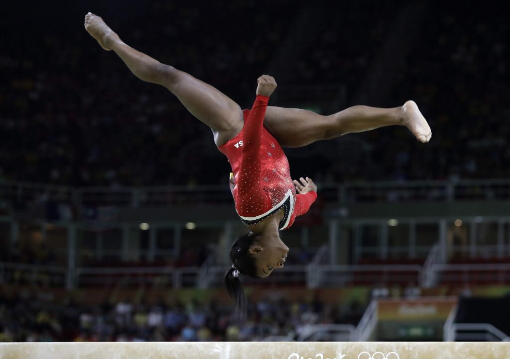 United States' Simone Biles performs on the balance beam during the artistic gymnastics women's apparatus final at the 2016 Summer Olympics in Rio de Janeiro, Brazil, Monday, Aug. 15, 2016. (AP Photo/Rebecca Blackwell)