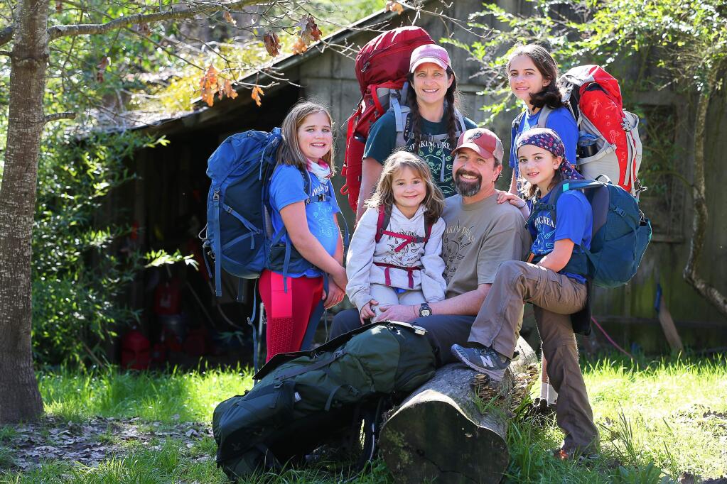 Chris And Jamie Malone, center, are taking their daughters, Harper, left, 10, Sabina, 5, Maya, 12, and Josie, 8, to hike the 2,200 mile Appalachian trail. The family will begin their journey in Georgia,on February 28, and complete the six-month hike in August, ending in Maine.(Christopher Chung/ The Press Democrat)