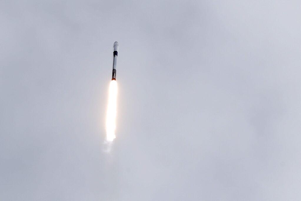 A Falcon 9 SpaceX rocket lifts off during a test flight to demonstrate the capsule's emergency escape system at the Kennedy Space Center in Cape Canaveral, Fla., Sunday, Jan. 19, 2020. (AP Photo/John Raoux)