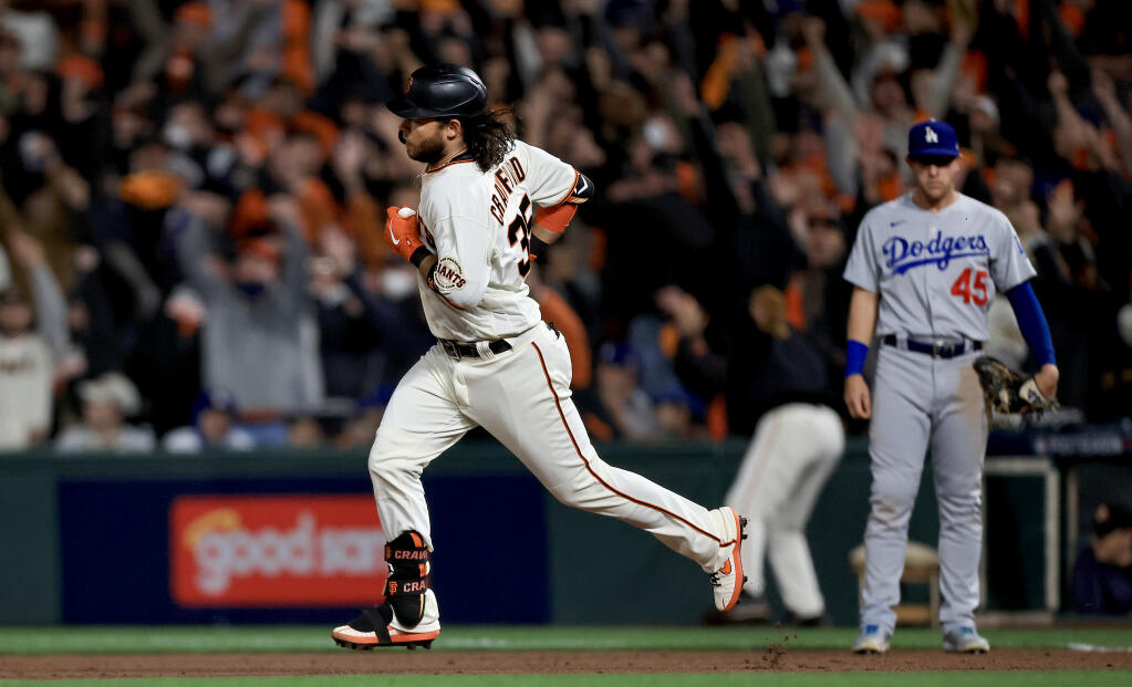 Brandon Crawford circles the bases after a solo home run in the eighth inning during game 1 of the National League Division Series against the Dodgers on Friday, Oct. 10, 2021 in San Francisco. The Giants won 4-0. (Kent Porter / The Press Democrat)