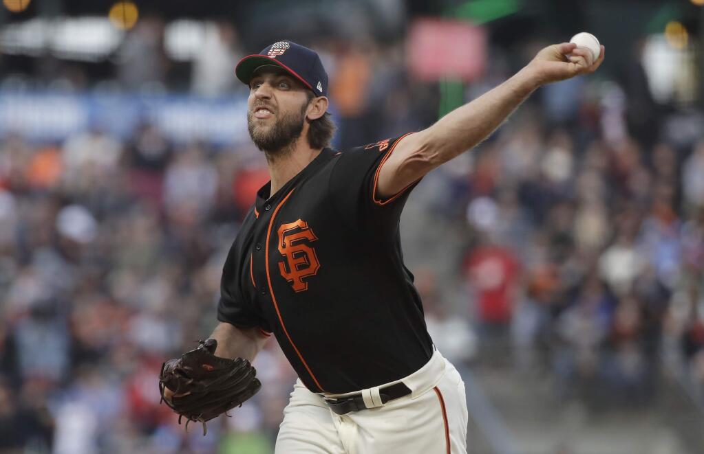 San Francisco Giants pitcher Madison Bumgarner throws to a St. Louis Cardinals batter during the first inning in San Francisco, Saturday, July 6, 2019. (AP Photo/Jeff Chiu)