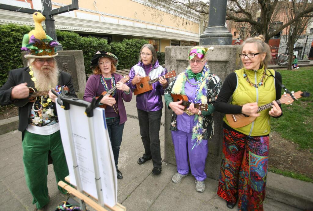 Members of the Petalutes Ban, left to right, Jason Todd Petalutes, Elfi Mitschan, Mary Peterson, Nancy Todd, and Amber Turner warm up the crowd before the 24th Annual Mardi Gras Mambofest street parade through downtown Petaluma on Fat Tuesday, February 17, 2015. (SCOTT MANCHESTER/ARGUS-COURIER STAFF)