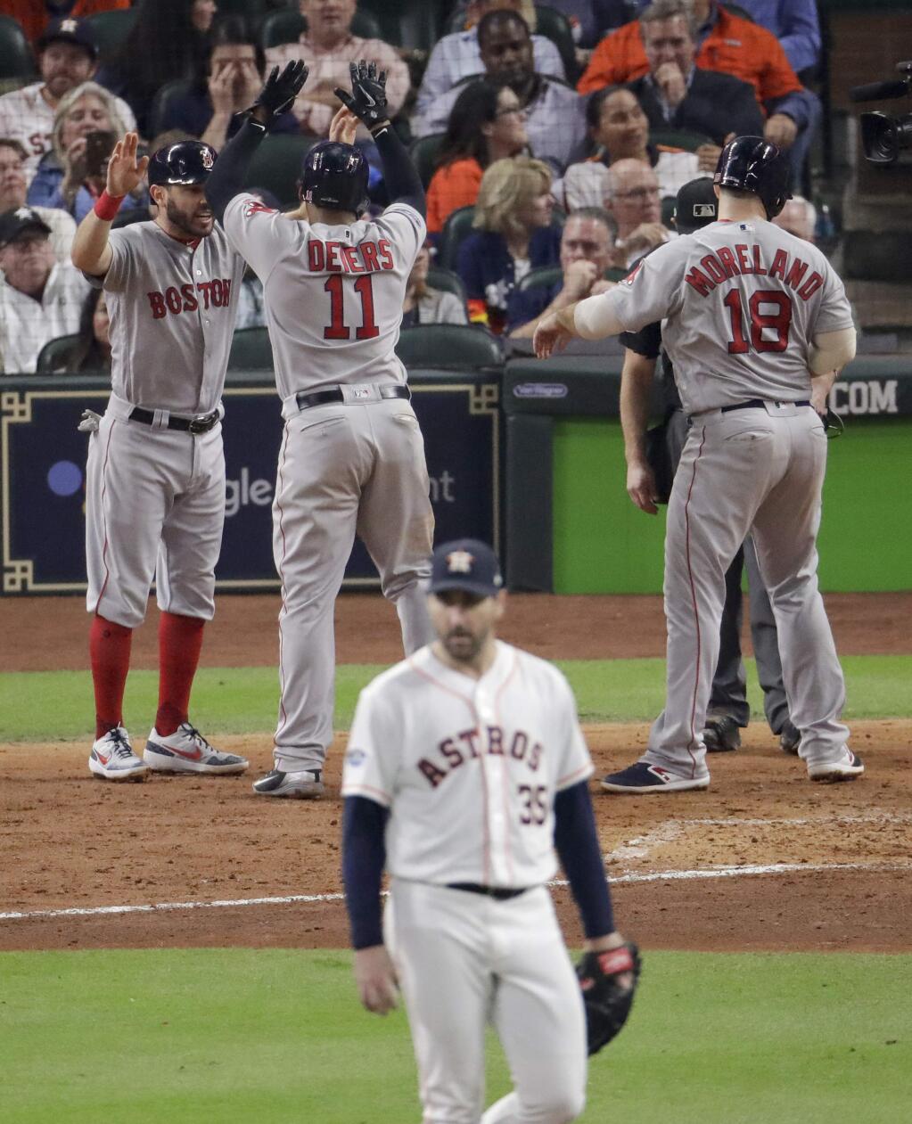 Boston Red Sox's Rafael Devers celebrates his three-run home run off Houston Astros starting pitcher Justin Verlander during the sixth inning in Game 5 of a baseball American League Championship Series on Thursday, Oct. 18, 2018, in Houston.(AP Photo/Lynne Sladky)