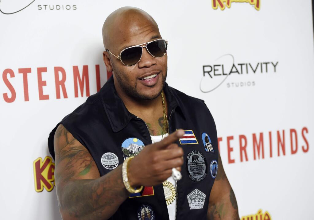 Musician Flo Rida poses at the premiere of the film 'Masterminds' at the TCL Chinese Theatre on Monday, Sept. 26, 2016, in Los Angeles. (Photo by Chris Pizzello/Invision/AP)
