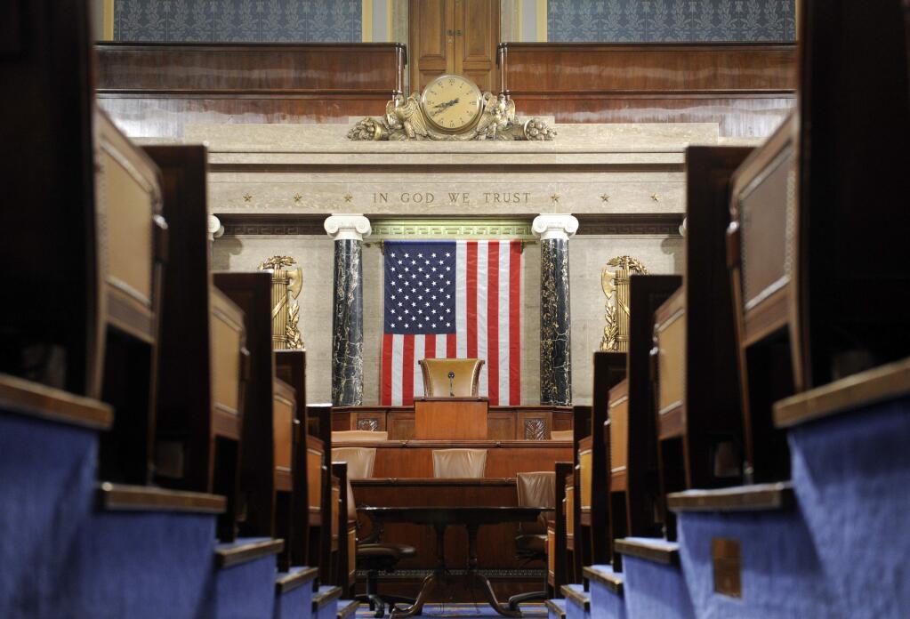 FILE - This Dec. 8, 2008, file photo shows the House Chamber on Capitol Hill in Washington. A presidential speech to Congress is one of those all-American moments that ooze ritual and decorum. The House sergeant-at-arms will stand at the rear of the House of Representatives on Tuesday night and announce the arrival of Donald Trump before a joint session of Congress by intoning: “Mister Speaker, the President of the United States” just like always. (AP Photo/Susan Walsh, File)