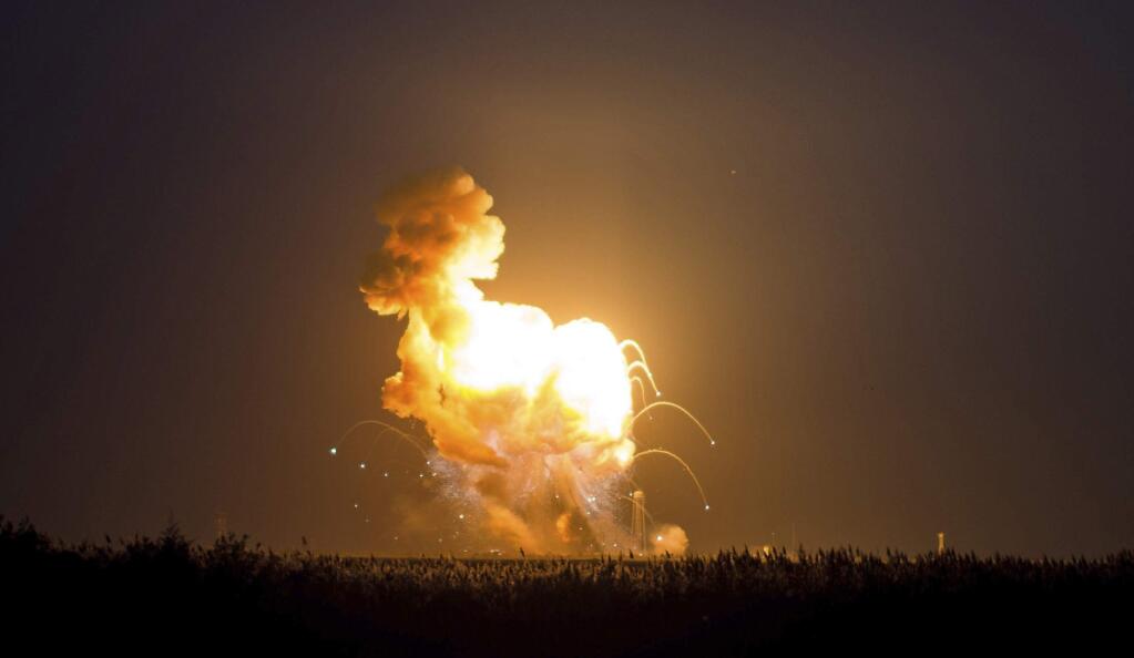 This image provided by NASA shows the Orbital Sciences Corporation Antares rocket, with the Cygnus spacecraft onboard, as it suffers a catastrophic anomaly moments after launch from the Mid-Atlantic Regional Spaceport Pad 0A, Tuesday, Oct. 28, 2014, at NASA's Wallops Flight Facility in Virginia. (AP Photo/NASA, Joel Kowsky)