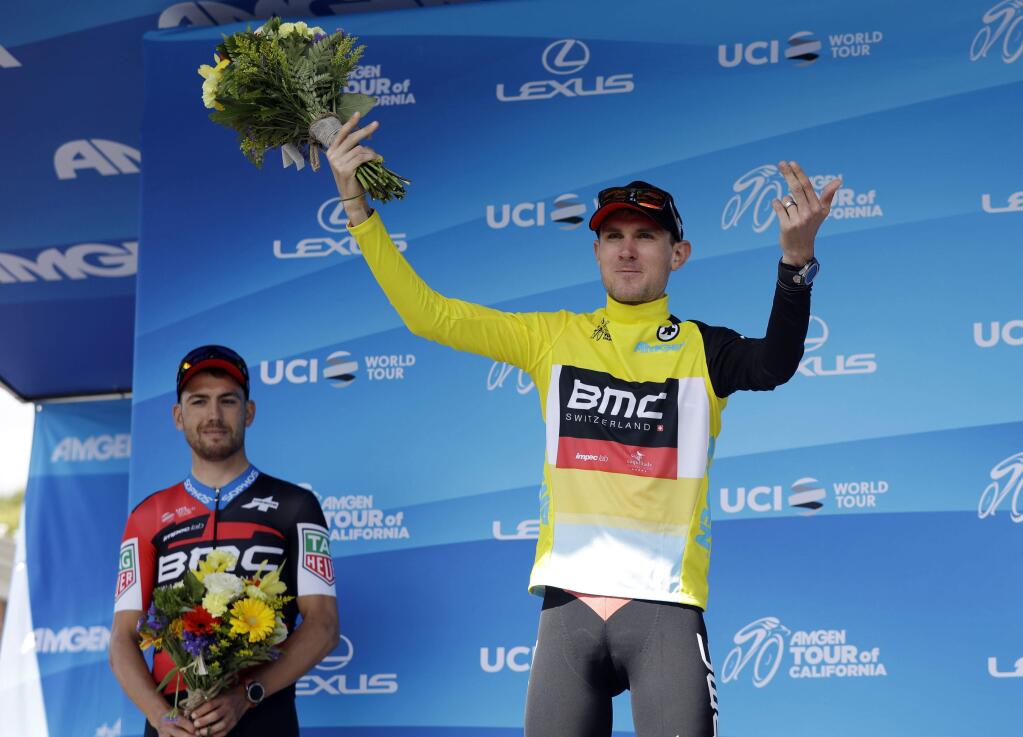Tejay Van Garderen celebrates on the podium after winning Stage 4, the individual time trial, of the Tour of California cycling race Wednesday, May 16, 2018, in Morgan Hill, Calif. At left is Patrick Bevin, of New Zealand. (AP Photo/Marcio Jose Sanchez)