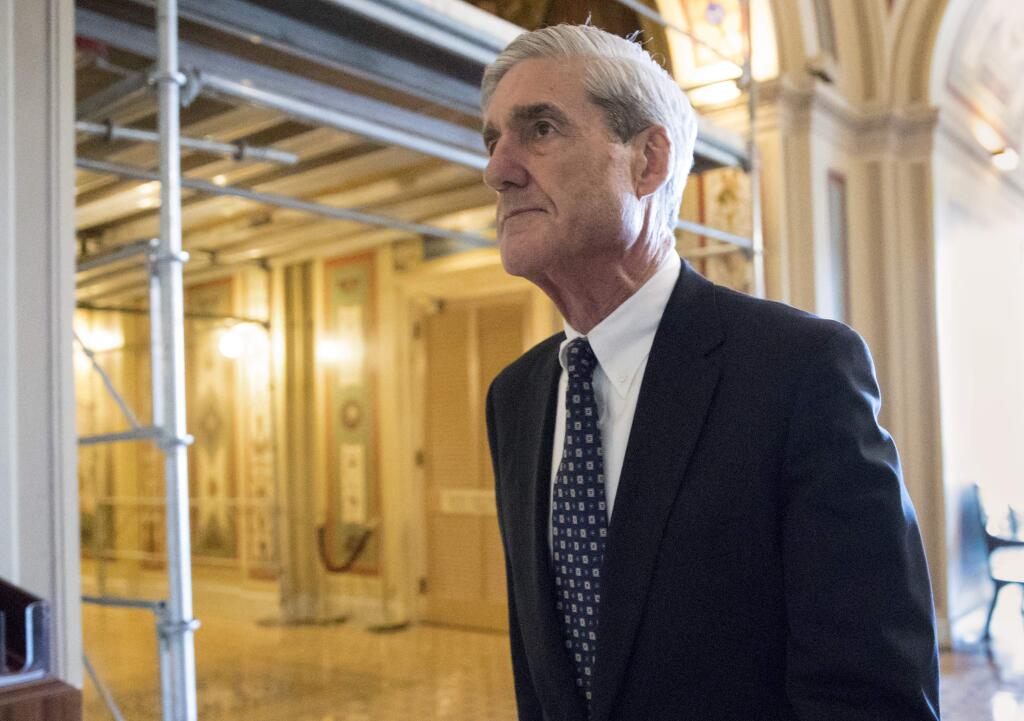 FILE - In this June 21, 2017, file photo, special counsel Robert Mueller departs after a meeting on Capitol Hill in Washington. Mueller is set to reveal more details about his Russia investigation as he faces court deadlines in the cases of two men who worked closely with President Donald Trump. (AP Photo/J. Scott Applewhite, File)